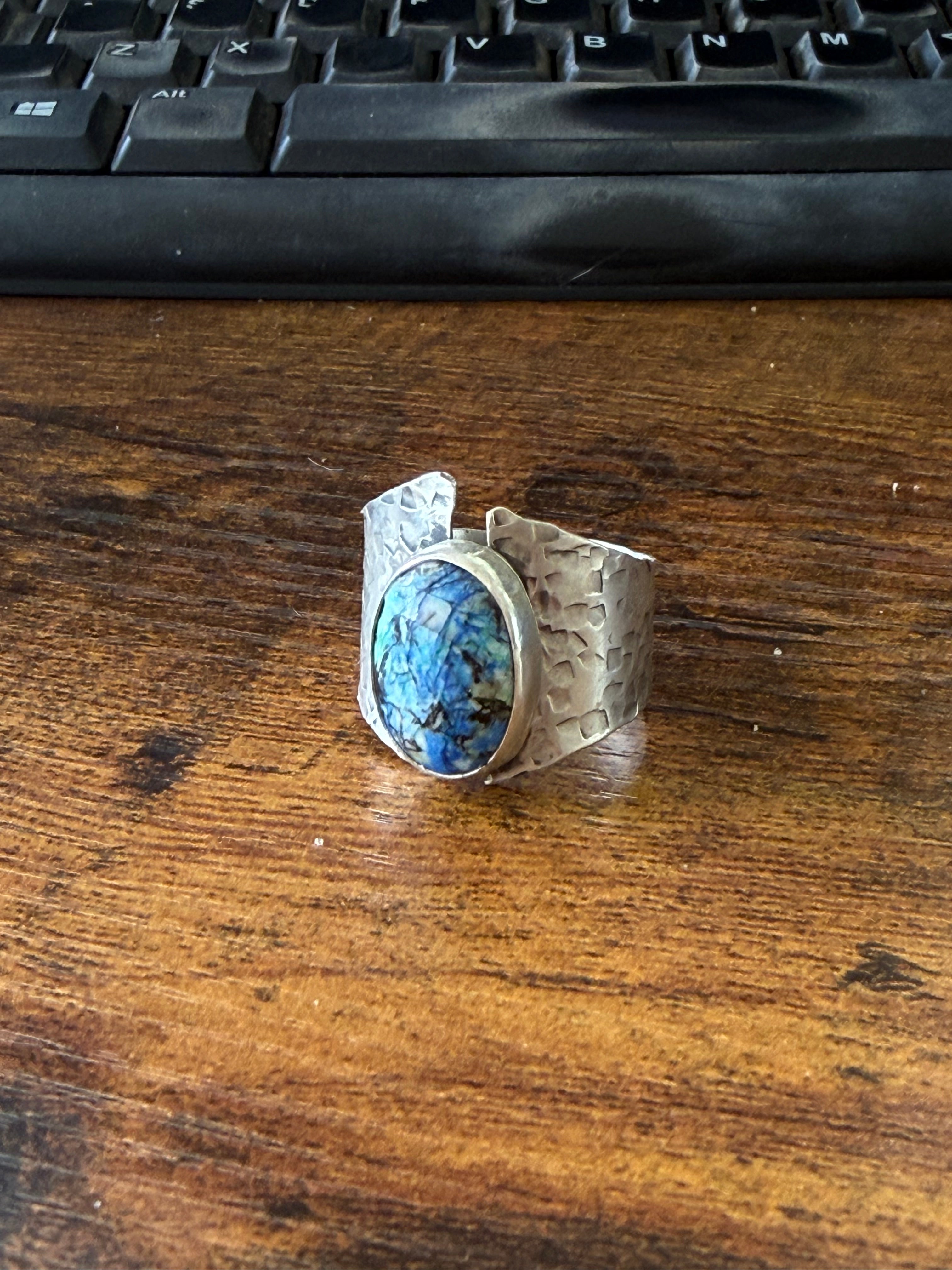 Hand-forged sterling silver ring with a natural Azurite gemstone filled with blues, cream and green colors made by Ginny Taylor Designs in her Roanoke, VA studio